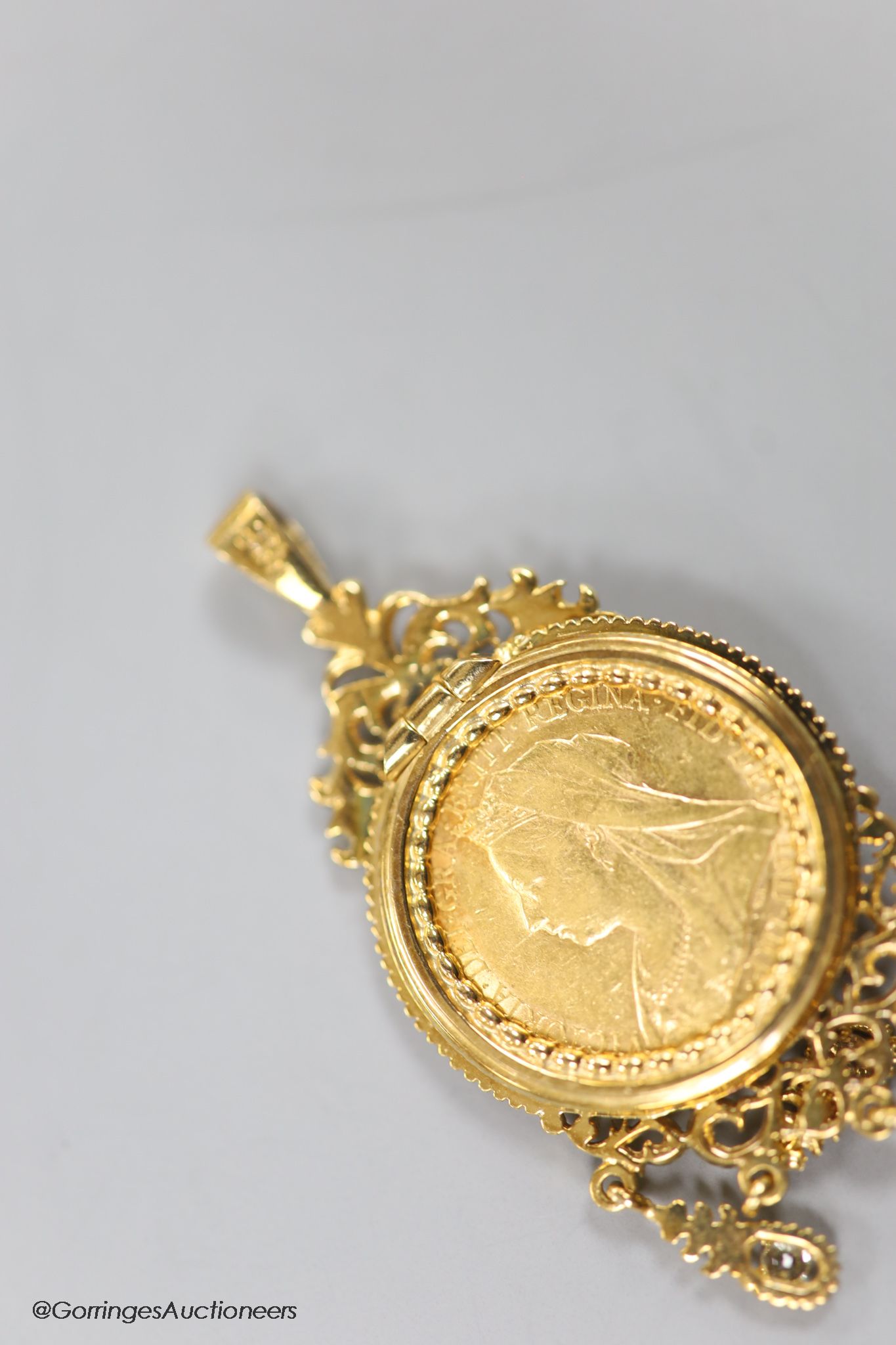 A Victoria 1900 gold sovereign, in a modern 9ct gold pendant tassel drop mount, gross 18 grams.